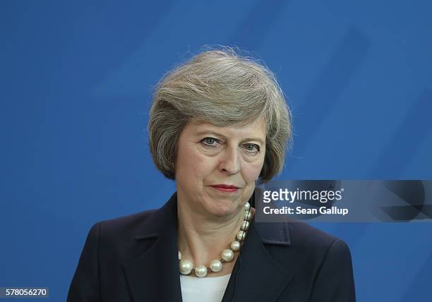British Prime Minister Theresa May speaks to the media with German Chancellor Angela Merkel following talks at the Chancellery on July 20, 2016 in...