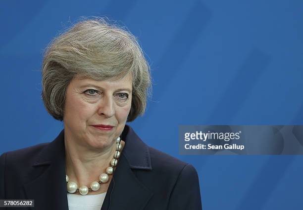 British Prime Minister Theresa May speaks to the media with German Chancellor Angela Merkel following talks at the Chancellery on July 20, 2016 in...