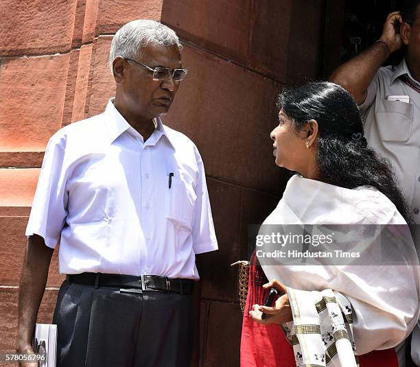 Rajya Sabha MP Kanimozhi talking to CPI leader D. Raja during the Parliament Monsoon Session on July 20, 2016 in New Delhi, India. The assault and...