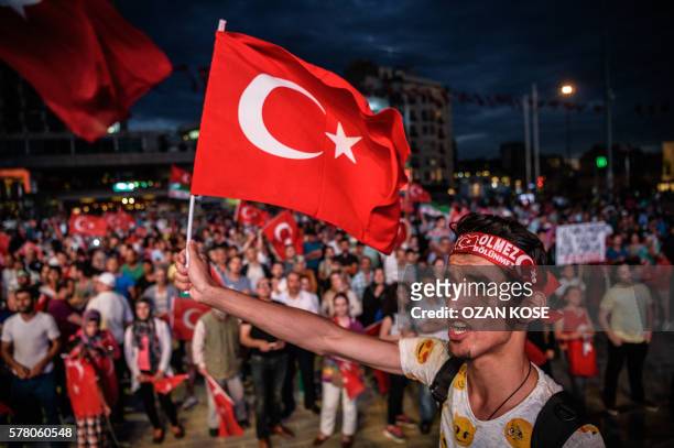 Pro Erdogan supporters gather at Taksim square on July 20, 2016 during a rally in Istanbul, following the failed military coup attempt of July 15....