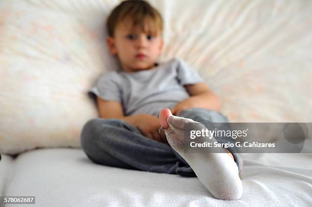 broken and dirty child sock - kids white socks stock pictures, royalty-free photos & images