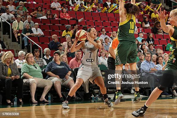 Haley Peters of the San Antonio Stars passes the ball against the Seattle Storm on July 20 at Key Arena in Seattle, Washington. NOTE TO USER: User...