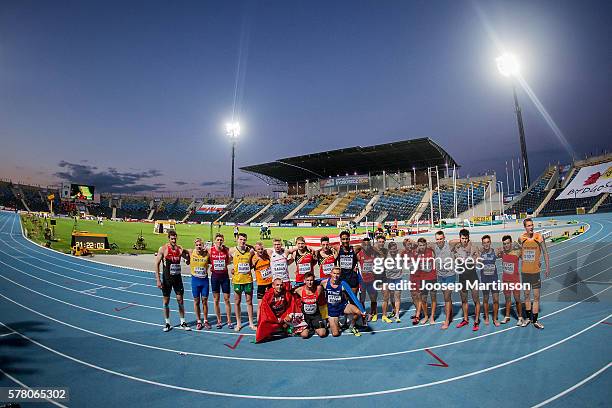 Competitors pose for a photo after finishing the menÕs 1500 metres decathlon during the IAAF World U20 Championships at the Zawisza Stadium on July...