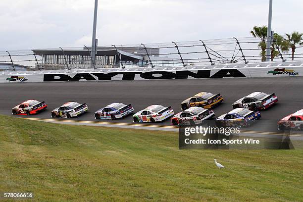 The field heads into turn 4 during the running of the NASCAR XFINITY Series - Alert Today Florida 300 race at Daytona International Speedway in...