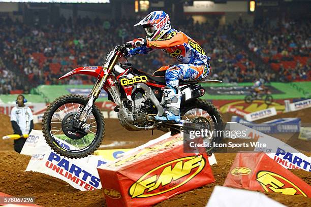 Honda 250cc rider Justin Bogle hanging on while blasting the whoops in round 8 of the AMA Monster Energy FIM World Championship Supercross, held at...