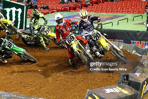 Soaring Eagle,Suzuki 450cc rider Broc Tickle and Ronnie Stewart enter a turn together in front of a triple jump in round 8 of the AMA Monster Energy...