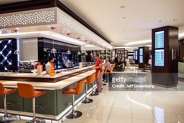 United Arab Emirates, Abu Dhabi International Airport, terminal concourse, Etihad First Business Class Lounge bar pub.