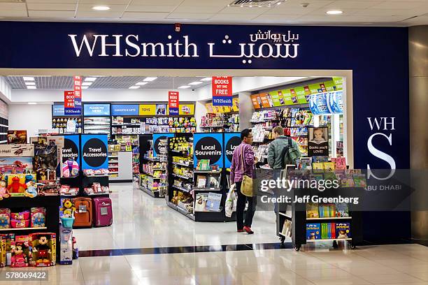 United Arab Emirates, Abu Dhabi International Airport, terminal concourse, shopping WH Smith front entrance sale souvenirs.