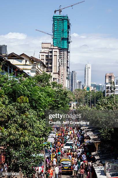 India Mumbai Lower Parel Dhuru Wadi Sitaram Jadhav Marg Sunday Market shopping sale selling buying vendors stalls busy new modern skyscraper high...