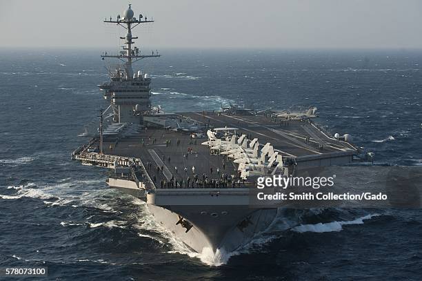 The aircraft carrier USS George Washington CVN 73 is in the East China Sea during a trilateral exercise with the Japan Maritime Self Defence Force...