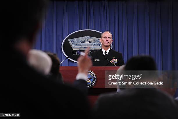 Members of the press raise their hands to ask Chief of Naval Operations CNO Admiral Jonathan Greenert questions during a press conference to update...