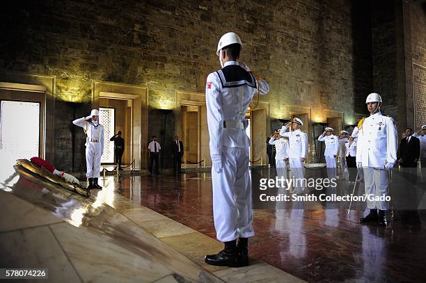 Chief of Naval Operations CNO Admiral Jonathan Greenert salutes a wreath he and Turkish navy honor guard sailors ceremoniously placed in the Hall of...