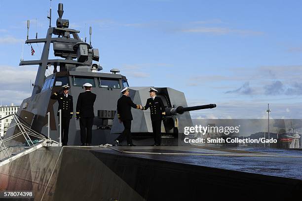 Chief of Naval Operations CNO Admiral Jonathan Greenert is greeted by the commanding officer of the Skjold-class coastal corvette HNoMS Skudd P962...