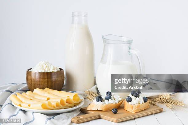 assorted farmers dairy products on white table - dairy product fotografías e imágenes de stock