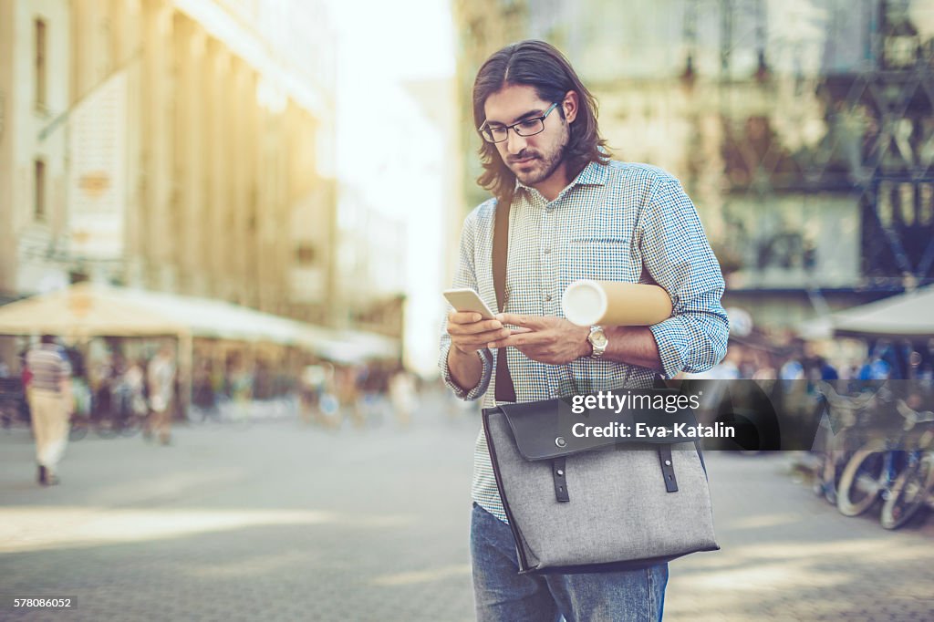 Young businessman in a city