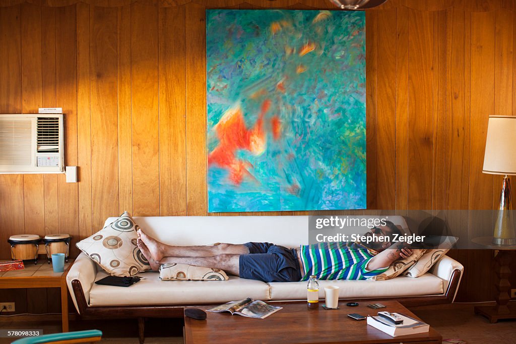 Man laying on sofa