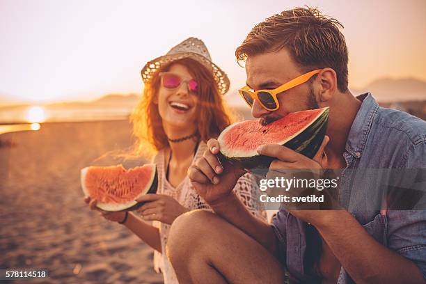 juicy and sweet summer - couple on beach sunglasses stockfoto's en -beelden