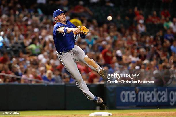 Infielder Josh Donaldson of the Toronto Blue Jays fields a ground ball out during the seventh inning of the interleague MLB game against the Arizona...