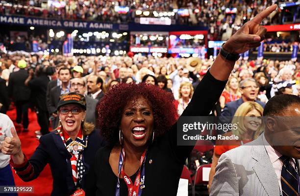 Delegates and attendees dance before the start of the third day of the Republican National Convention on July 20, 2016 at the Quicken Loans Arena in...