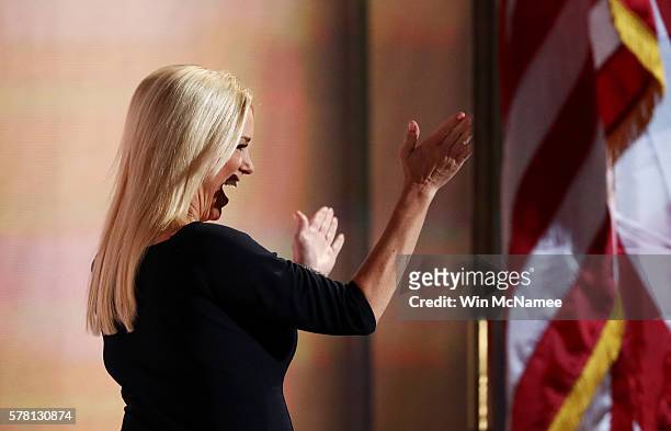 Florida Attorney General Pam Bondi waves to the crowd as she walks on stage to deliver a speech on the third day of the Republican National...
