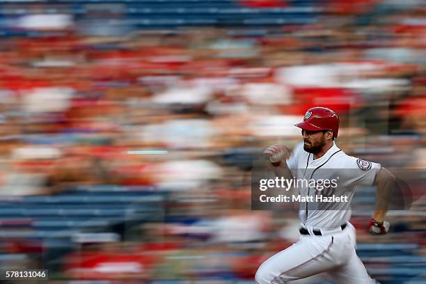 Daniel Murphy of the Washington Nationals runs to second base after hitting a double in the first inning against the Los Angeles Dodgers at Nationals...