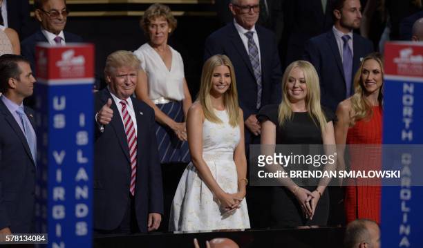 Republican presidential candidate Donald Trump stands with his son Donald Trump, Jr. , daughters Ivanka Trump and Tammy Trump , and daughter-in-law...