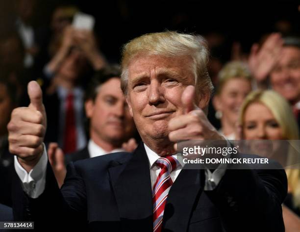 Republican presidential candidate Donald Trump gives a double thumbs-up on day three of the Republican National Convention at the Quicken Loans Arena...