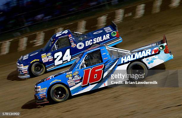 Stewart Friesen, driver of the Halmar International Chevrolet, and Kyle Larson, driver of the DC Solar Chevrolet, race during NASCAR Camping World...