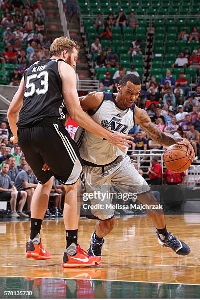 Joel Bolomboy of Utah Jazz drives to the basket against the San Antonio Spurs during the 2016 Utah Summer League at vivint.SmartHome Arena on July 4,...