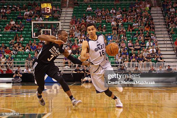 Marcus Paige of Utah Jazz handles the ball against Will Cummings of San Antonio Spurs during the 2016 Utah Summer League at vivint.SmartHome Arena on...