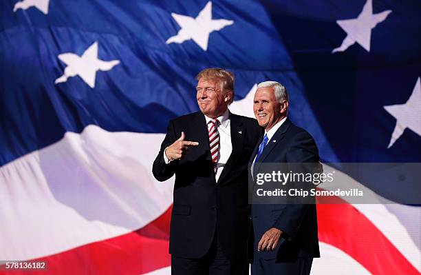 Republican presidential candidate Donald Trump stand with Republican vice presidential candidate Mike Pence and acknowledge the crowd on the third...