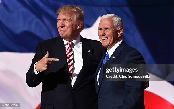 Republican presidential candidate Donald Trump stands with Republican vice presidential candidate Mike Pence and acknowledge the crowd on the third...