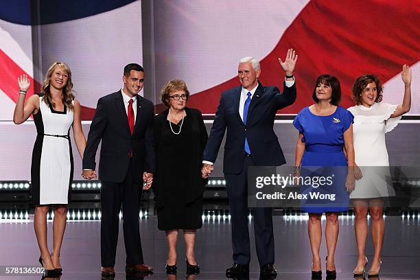 Republican vice presidential candidate Mike Pence acknowledges the crowd along with by Sarah Whiteside , Michael Pence , mother Nancy Pence , wife...