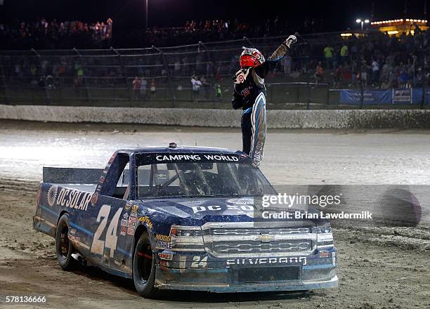 Kyle Larson, driver of the DC Solar Chevrolet, celebrates after winning the NASCAR Camping World Series 4th Annual Aspen Dental Eldora Dirt Derby...