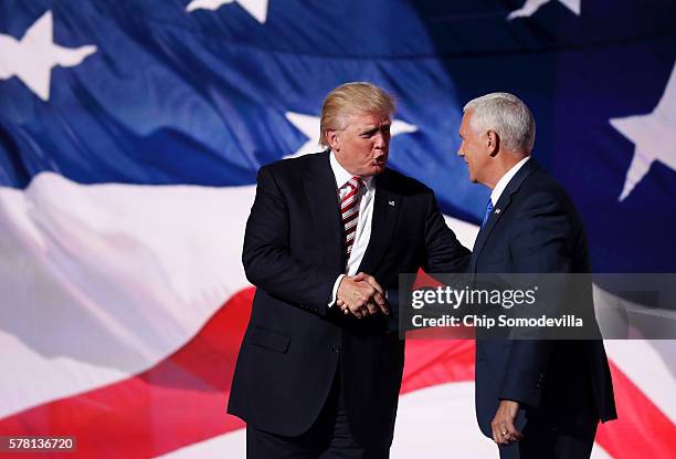 Republican presidential candidate Donald Trump stands with Republican vice presidential candidate Mike Pence after he delivered a speech on the third...