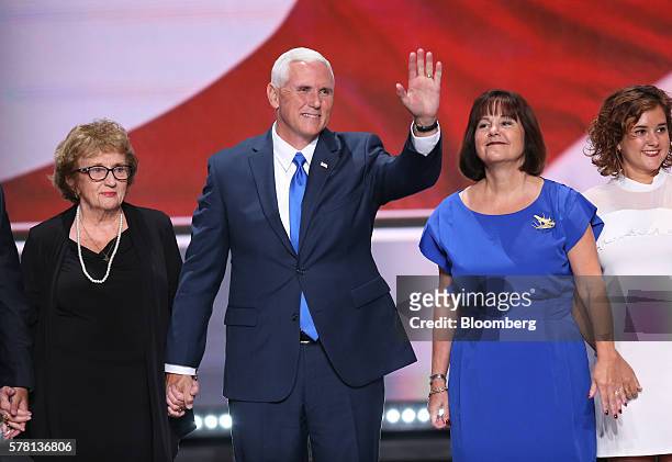 Mike Pence, 2016 Republican vice presidential nominee, second left, waves while on stage with mother Nancy Pence-Fritsch, left, wife Karen Pence and...