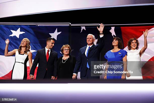 Republican vice presidential candidate Mike Pence waves to the crowd along with his mother Nancy Pence , and is accompanied by Sarah Whiteside ,...