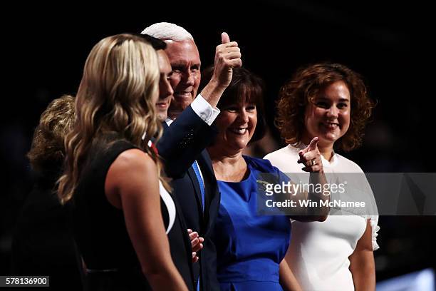 Republican vice presidential candidate Mike Pence gives a thumbs up to the crowd while accompanied by his mother Nancy Pence , Sarah Whiteside ,...