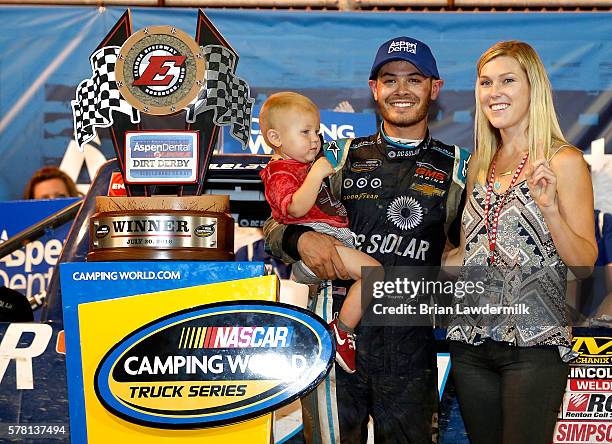 Kyle Larson, driver of the DC Solar Chevrolet, Owen Larson and Katelyn Sweet pose with the NASCAR Camping World Series 4th Annual Aspen Dental Eldora...