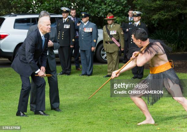 Vice President Joe Biden reacts during a traditional Maori welcome ceremony at Government House in Auckland on July 21, 2016. Biden is visiting New...