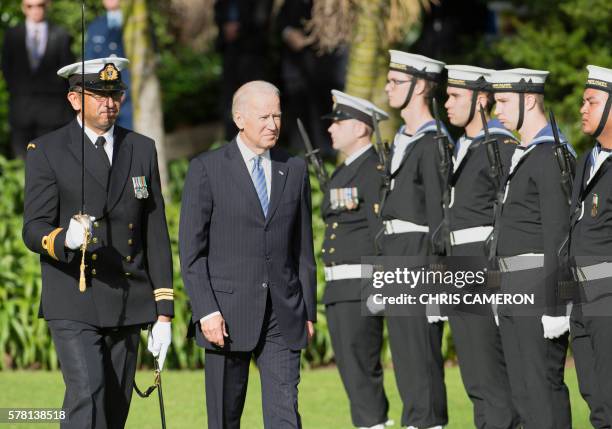 Vice President Joe Biden walks past a guard of honour during a welcoming ceremony at Government House in Auckland on July 21, 2016. Biden is visiting...