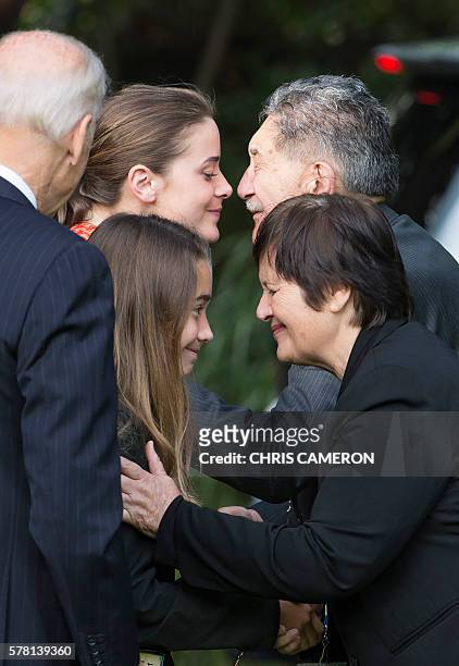 Vice President Joe Biden looks on as his granddaughters, 21-year-old Naomi Biden and 12-year-old Natalie Biden , are given a traditional Maori...