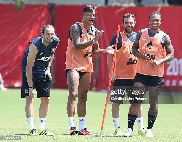 Daley Blind, Marcos Rojo, Juan Mata and Memphis Depay of Manchester United in action during a first team training session as part of their pre-season...