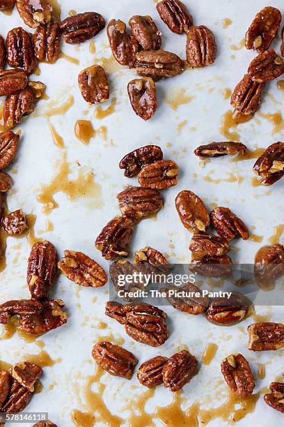 caramelized pecan nuts - caramel stock pictures, royalty-free photos & images
