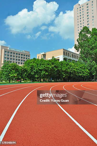 running track over trees and clouds. - einlauf ins stadion stock-fotos und bilder