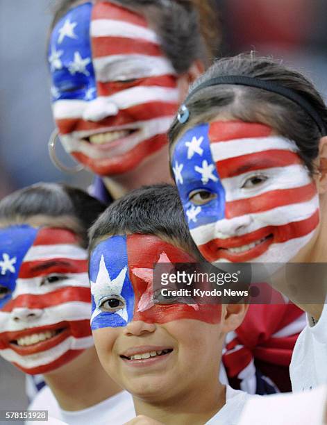 Germany - U.S. Fans have paintings of the U.S. National flag on their faces before Japan and the United States competed in the Women's World Cup...