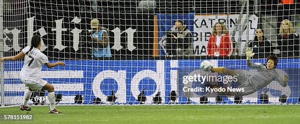 Germany - Japan goalkeeper Ayumi Kaihori blocks a penalty kick from Shannon Boxx of the United States, who was the first to shoot the U.S. Penalty...