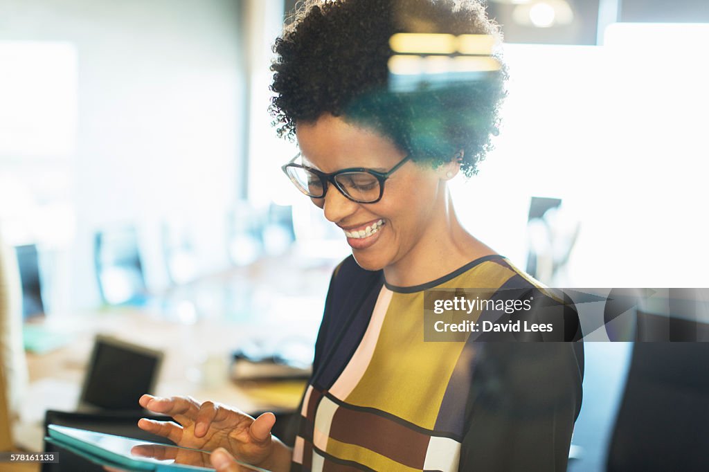 Businesswoman using digital tablet in meeting