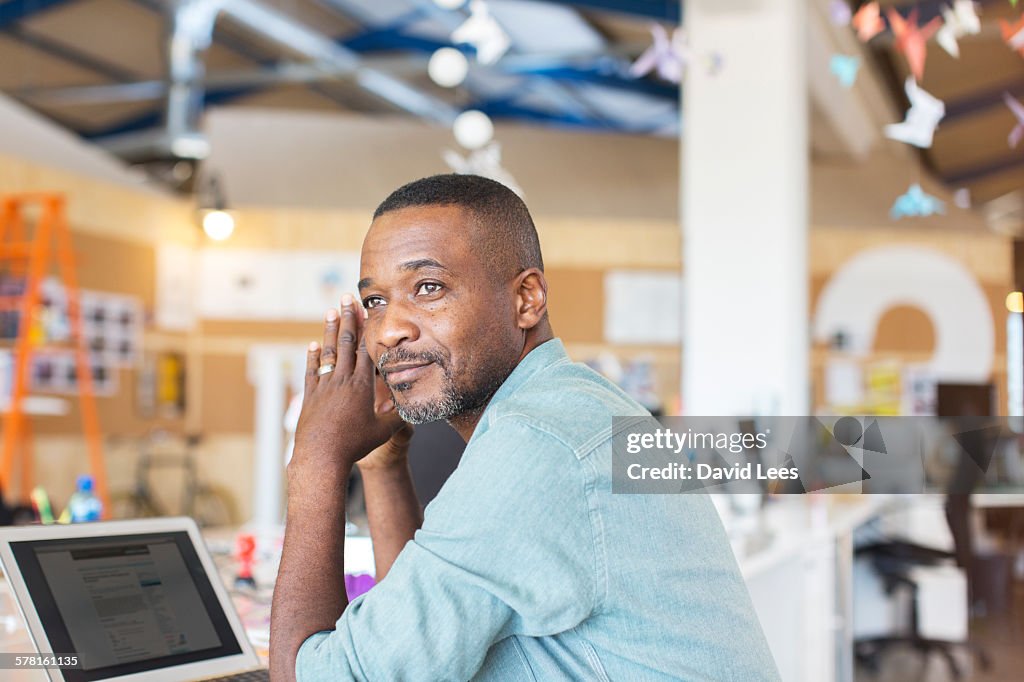 Businessman using laptop in office