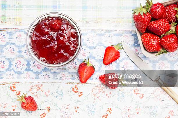 glass of strawberry jam and box of strawberries - strawberry jam stock pictures, royalty-free photos & images